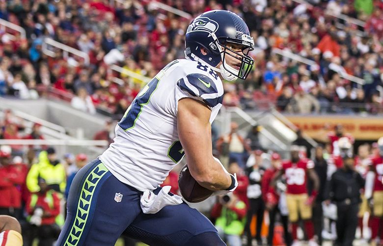 Seattle Seahawks tight end Jimmy Graham (88) brushes off a tackle by  Carolina Panthers outside linebacker A.J. Klein (56) at CenturyLink Field  in Seattle, Washington on December 4, 2016. Graham caught six