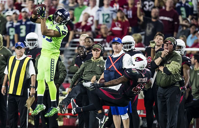 Seahawks wide receiver Doug Baldwin makes a catch against Cardinals strong safety Antoine Bethea, and runs the ball to the two-yard line for a 54-yard gain in the fourth quarter as the Seattle Seahawks take on the Arizona Cardinals Thursday November 9, 2017 at University of Phoenix Stadium in Glendale. 204114
