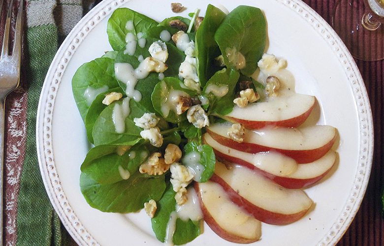 This Oct. 31, 2017 photo shows a green salad with pear dressing, Gorgonzola cheese and toasted walnuts in New York. This dish is from a recipe by Sara Moulton. (Sara Moulton via AP)