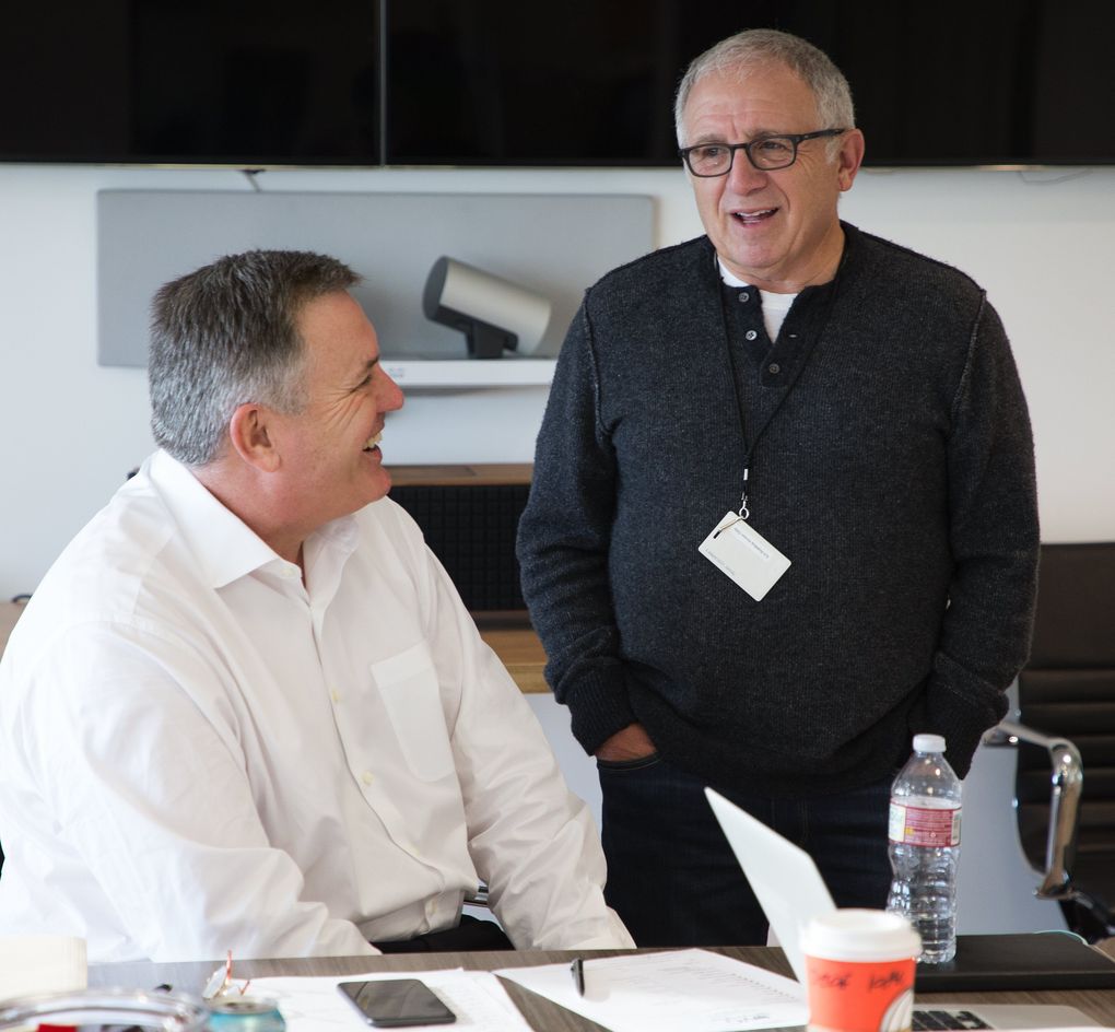 Oak View Group CEO Tim Leiweke, left, chats with Irving Azoff, entertainment executive and personal manager representing recording artists such as Christina Aguilera, The Eagles and Dan Fogelberg, in Leiweke’s Westwood office in Los Angeles. (Mike Siegel/The Seattle Times)