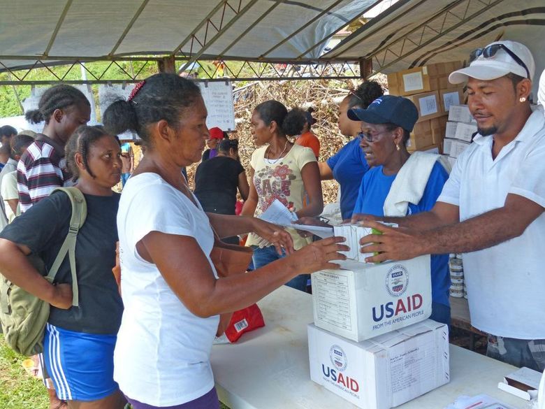 Hurricane Maria survivors in Salybia, a farming village in Dominica’s Kalinago territory, receive rations of rice, tuna, lentils, flour and salt that were being distributed by U.N. humanitarian agencies in cooperation with the government and local authorities.  (Jacqueline Charles/TNS)