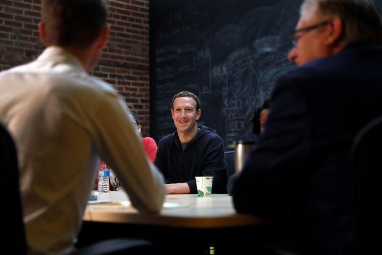 Facebook CEO Mark Zuckerberg meets with a group of entrepreneurs and innovators during a roundtable discussion at Cortex Innovation Community technology hub, Thursday, Nov. 9, 2017, in St. Louis. Zuckerberg was in St. Louis to announce a program to boost small businesses and bolster individual technical skills both on and off Facebook. (AP Photo/Jeff Roberson)