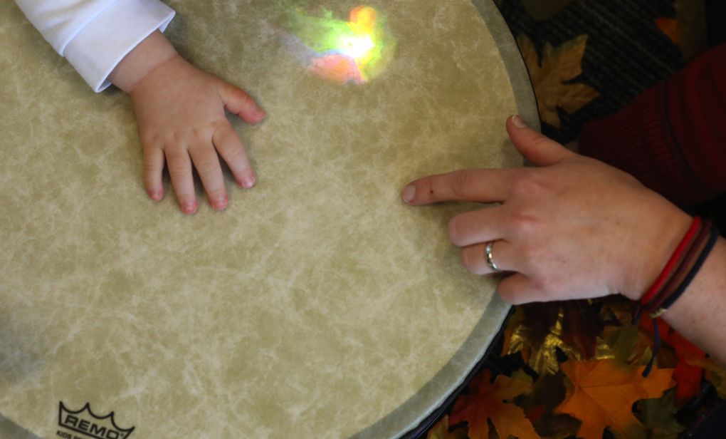 Franco Calvo doesn’t realize that playing with a drum at Kindering’s Bothell facility is also helping him to learn. (Ken Lambert/The Seattle Times)