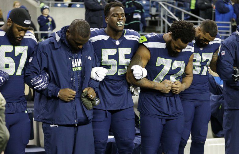 Michael Bennett, all the Seahawks stand for anthem before Arizona game