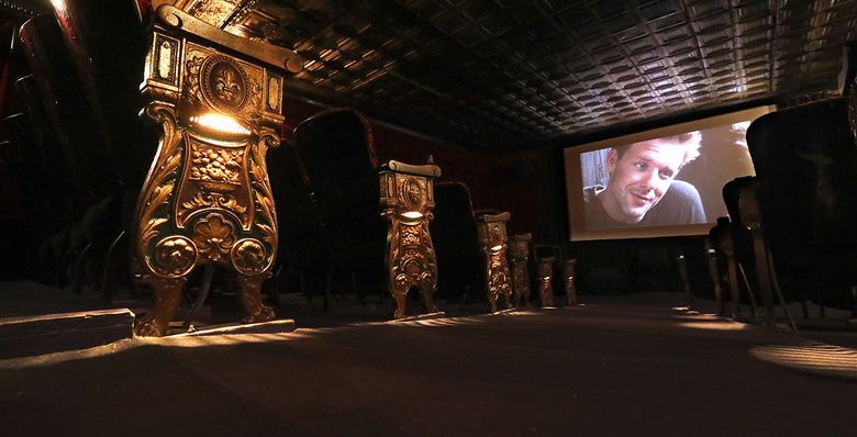 On the screen at the Grand Illusion is actor Mickey Rourke in “9½ Weeks,” which is being tested to an empty house to see if the DVD is projection-worthy. If so, the theater would receive permission to show the film, which dates from 1986.  (Ken Lambert / The Seattle Times)