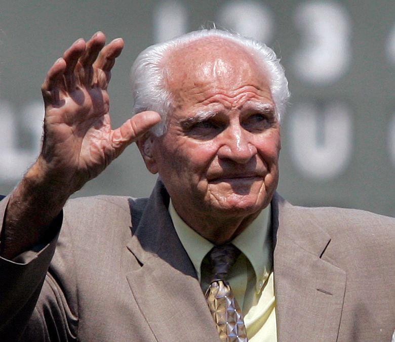 Boston Red Sox Hall of Famer Bobby Doerr waves to the crowd at Fenway Park in Boston, before a baseball game on Aug. 2, 2007. Doerr, a Hall of Fame second baseman who was dubbed the “silent captain” by longtime Red Sox teammate and lifelong friend Ted Williams, has died. He was 99.  (Elise Amendola/AP)