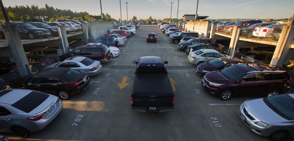 Commuters reach the top floor of the parking garage adjacent to Kent Station in search of an empty parking spot in the early morning of Monday, Sept. 11. Sound Transit says 51 percent of riders drive to Kent Station, but that doesn’t include those who drive and park off-site, estimated at 12 percent. (Ellen M. Banner/The Seattle Times)