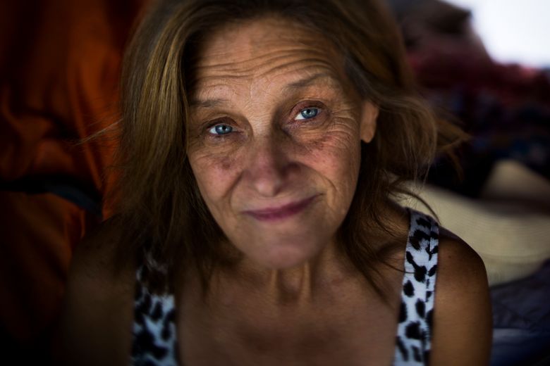 Tammy Stephen, 54, poses for a photo Tuesday, Sept. 26, 2017, in Seattle. Stephen lives in Camp Second Chance, a city-sanctioned homeless encampment in Seattle. “Housing here is out of control. That’s why we have so many people on the street,” she said. “There’s nowhere for them to go.” (AP Photo/Jae C. Hong)