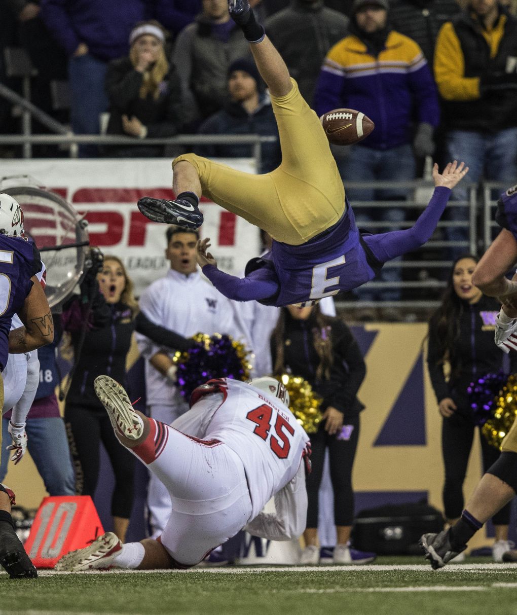 On fourth down, Jake Browning reaches for the first-down marker but is upended by Utah’s Filipo Mokofisi on a key fourth-quarter play. The Utes seemed in good shape after the stop, but UW rallied in the final minute. (Dean Rutz/The Seattle Times)