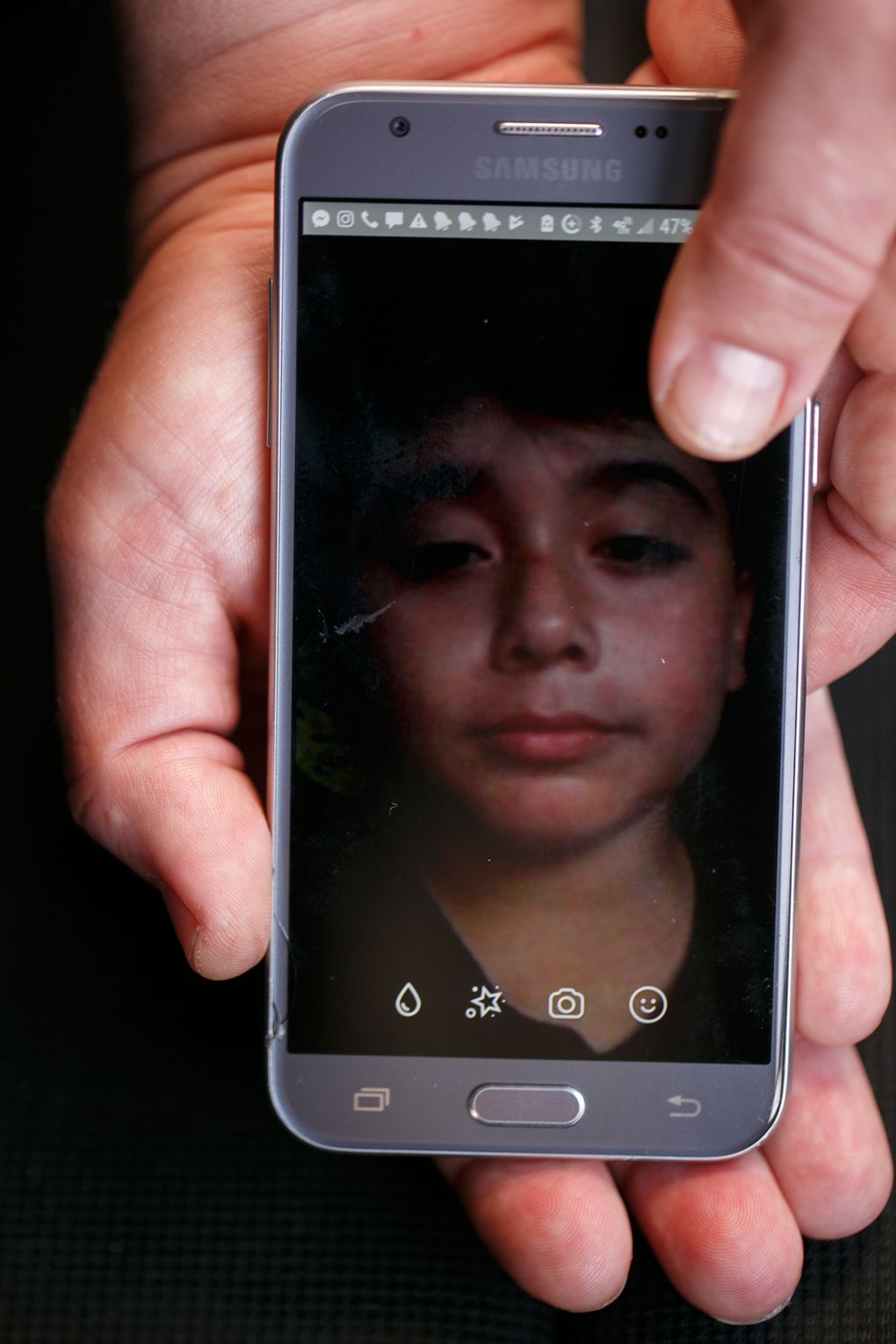 From Mexico, Joel often video chats with friends back in Pacific County. An American citizen, he recently rejoined his father, who was deported. (Erika Schultz / The Seattle Times)
