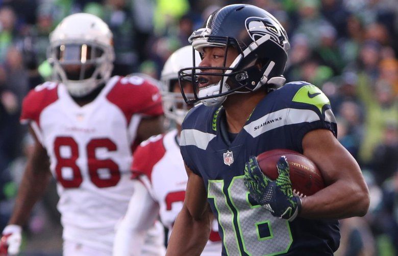 Seattle Seahawks wide receiver Tyler Lockett (16) is wrapped by Los Angeles  Rams Kickoff team during the first quarter at CenturyLink Field on October  7, 2018 in Seattle, Washington. The Rams beat