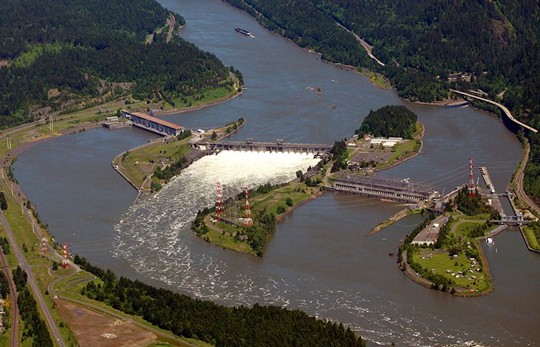 FILE – This June 3, 2011, file photo, shows the Bonneville Dam on the Columbia River near Cascade Locks, Ore. Politicians from both major U.S. parties are praising a decision to start negotiations early next year over the future of a treaty between America and Canada that governs hydropower and flood control operations along the Columbia River, which starts in British Columbia and flows into the U.S., eventually ending at the Pacific Ocean.(AP Photo/Rick Bowmer, File) PDX601 PDX601