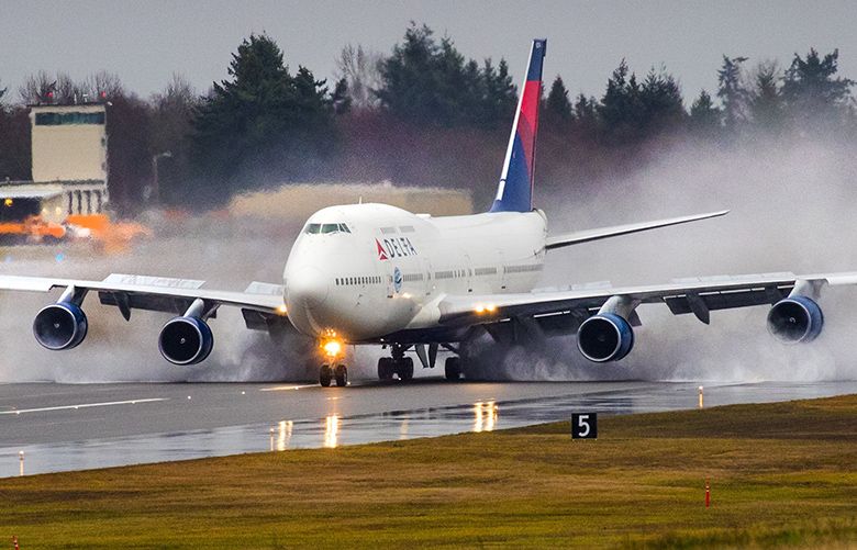 A Delta Air Lines 747 that will retire by year end, one of the last of these jumbo jets to fly for a U.S. carrier, visits its birthplace, Everett, on a farewell tour of the country on December 18, 2017. The jumbo jet lands at Paine Field on a wet and rainy morning.