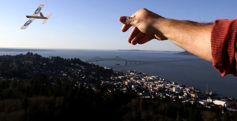 It’s 164 steps to the top of the Astoria Column, and from there you can toss a balsa-wood airplane bought at the gift shop for $1. Below are the city and the Astoria-Megler Bridge, which connects Oregon and Washington by U.S. 101. (Alan Berner/The Seattle Times)