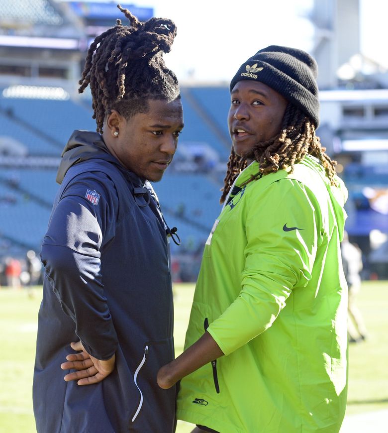 Charlotte, North Carolina, USA. 25th Nov, 2018. Seattle Seahawks Griffin  Twins, linebacker SHAQUEM GRIFFIN (49) and his brother cornerback SHAQUILL  GRIFFIN (26) pose after beating the Carolina Panthers on November 25, 2018