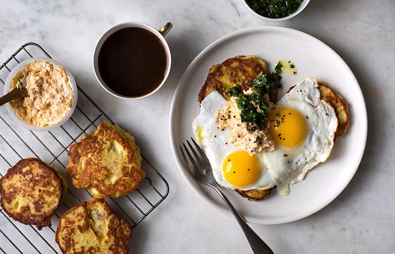 A big breakfast of fried eggs and potato hot cakes with cheddar cream and salsa verde, in New York, Dec. 8, 2017. Long, lazy weekends were made for big, homemade breakfasts. (Andrew Scrivani/The New York Times)