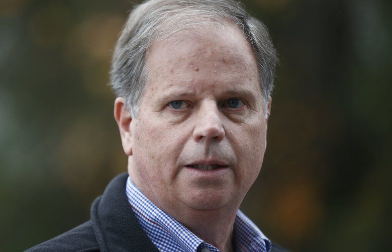 FILE – In this Dec. 4, 2017, file photo, then-Democratic senatorial candidate Doug Jones speaks at a news conference in Dolomite, Ala. Jones, the first Alabama Democrat elected to the Senate in a quarter century, is one of two new members who will take the oath of office on the Senate floor at noon on Jan. 3, 2018. (AP Photo/Brynn Anderson, File) WX201 WX201