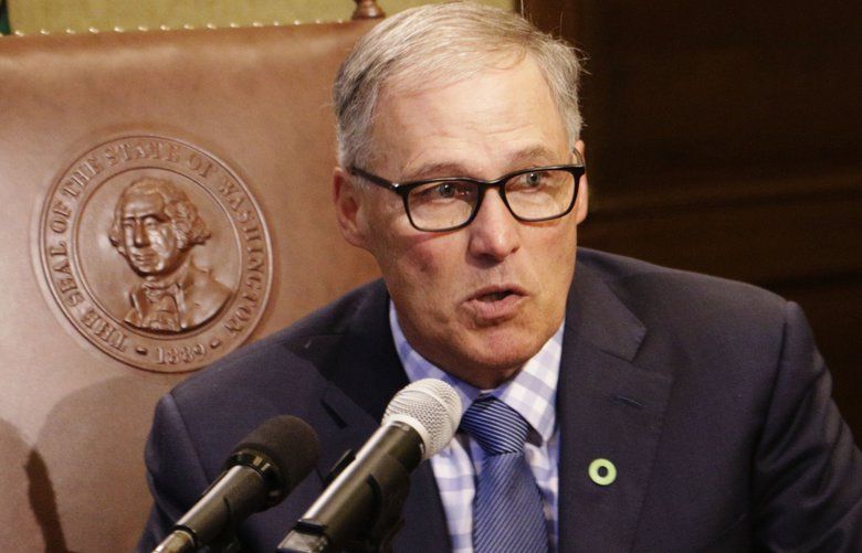 FILE – In this June 27, 2017, file photo, Gov. Jay Inslee talks to reporters about ongoing budget negotiations, in Olympia, Wash. As chairman of the Democratic Governors Association, Inslee will be working to elect governors from his party this year to counteract the Republican dominance in state legislatures. Governors in most states are key to the redistricting process that will follow the 2020 Census. (AP Photo/Rachel La Corte, File) NYAG302 NYAG302