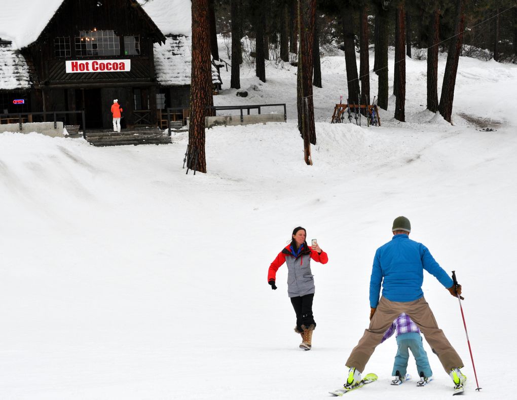 Getting a photo of a ski lesson, with the reward of hot cocoa promised at the vintage lodge at Leavenworth Ski Hill. (Jeff Layton)