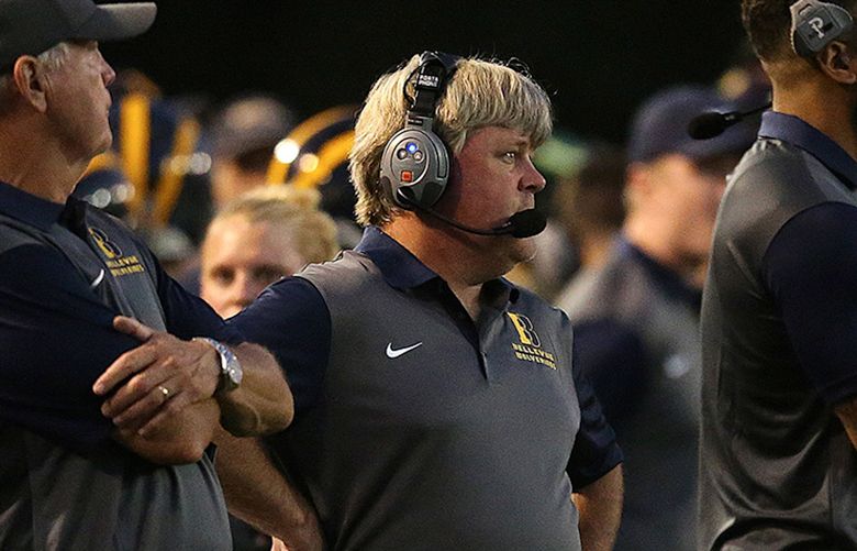 Assistant Coach Pat Jones is acting head coach during the Wolverine’s season opener against number one ranked Bishop Gorman at Bellevue High School in Bellevue, Wash., Friday, September 11, 2015.