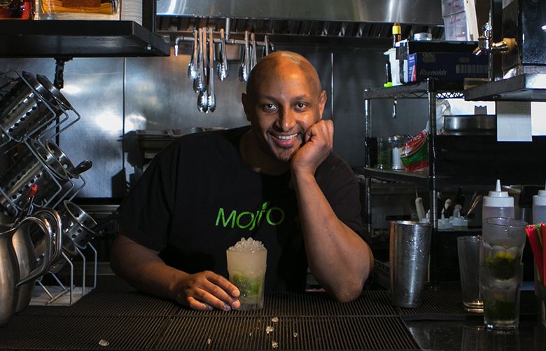 Luam Werson, chef and owner of Mojito, a Latin American and Cuban restaurant on Lake City Way in Seattle, stands in his kitchen and looks out towards the restaurant Thursday, December 28, 2017. Werson was an immigrant dish washer who worked his way all the way up to chef and now owns the very restaurant where he used to wash dishes.