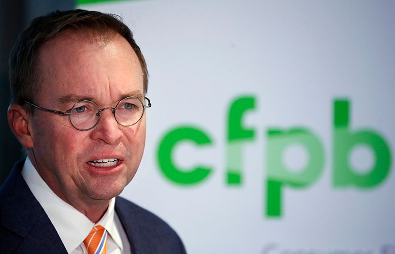 FILE – In this Monday, Nov. 27, 2017, file photo, Mick Mulvaney speaks during a news conference after his first day as acting director of the Consumer Financial Protection Bureau in Washington. Mulvaney said Wednesday, Jan. 17, 2018, that he is launching a review of all the federal consumer watchdog agency’s policies and priorities. (AP Photo/Jacquelyn Martin, File)
