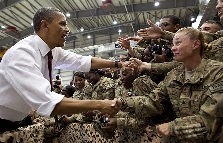 President Barack Obama greets U.S. troops following his remarks at Bagram Air Field, Afghanistan, May 1, 2012. (Official White House Photo by Pete Souza)This official White House photograph is being made available only for publication by news organizations and/or for personal use printing by the subject(s) of the photograph. The photograph may not be manipulated in any way and may not be used in commercial or political materials, advertisements, emails, products, promotions that in any way suggests approval or endorsement of the President, the First Family, or the White House.