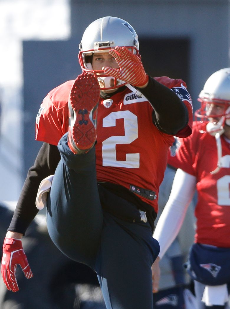 New England Patriots Tom Brady stretches during practice before