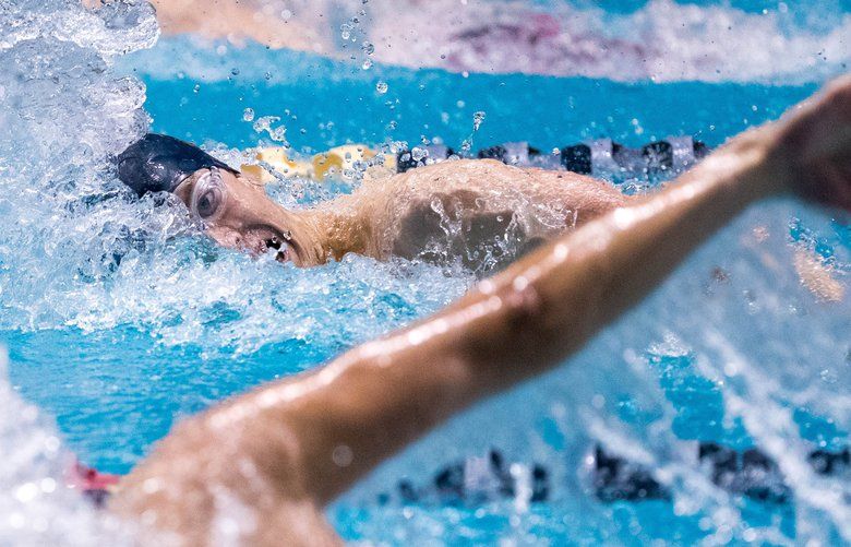 Makai Ingalls of Bainbridge competes in the 400-yard freestyle relay where they finished first during the 3A state swimming and diving state championships at the Weyerhaeuser King County Aquatic Center in Federal Way on Saturday.(Courtney Pedroza / The Seattle Times)