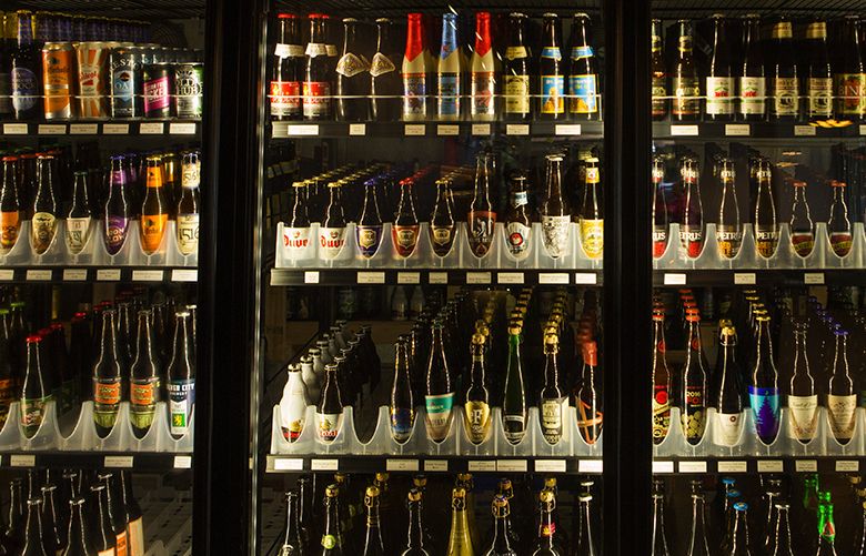 Teku Tavern, a new beer place at 552 Denny Way in Seattle, has 400 different bottles in its ‘beer forest’: 29 fridges of beer. The tavern also has 50 beers on tap and three on cask engine. Customers can drink beer from the tap or from the bottle. By the end of the year, they plan to have 1200 different bottles of beer available. Customers can also buy bottles of beer to go. (Ellen M. Banner / The Seattle Times)