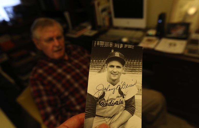 An autographed photo of Johnny O’Brien when he was a St. Louis Cardinal infielder in 1958. , star at Seattle University and beyond’ (Alan Berner/The Seattle Times)