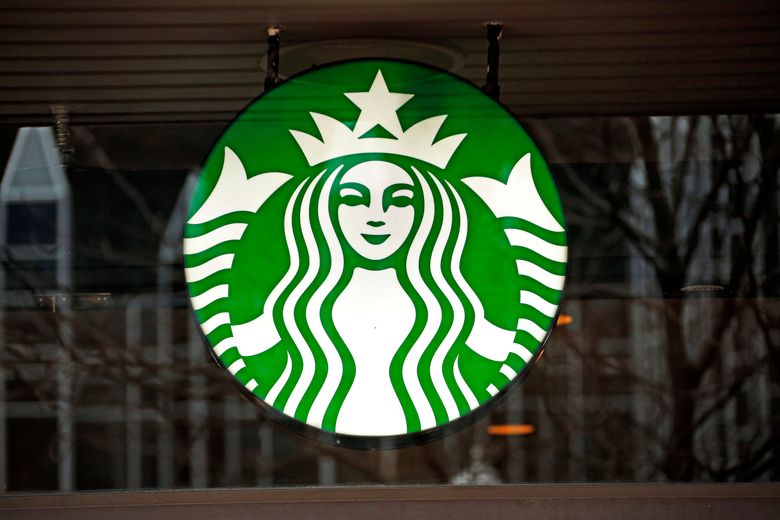 FILE – This Thursday, Jan. 12, 2017, file photo shows a Starbucks logo sign in the window of one of the chain’s cafes in Pittsburgh. On Thursday, Feb. 1, 2018, Starbucks launches its Starbucks Rewards credit card, in cooperation with JPMorgan Chase and Visa. The Starbucks Rewards credit card has a $49 annual fee and lets cardholders earn free Starbucks drinks and food for purchases made in and out of the coffee chain. (AP Photo/Gene J. Puskar, File)