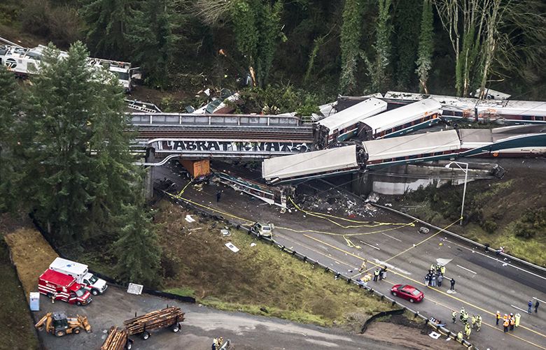 An Amtrak train derailed and fell off of a bridge and onto Interstate 5 near Mounts Road between Lakewood and Olympia Washington Monday December 18, 2017. 204596 (Bettina Hansen / The Seattle Times)