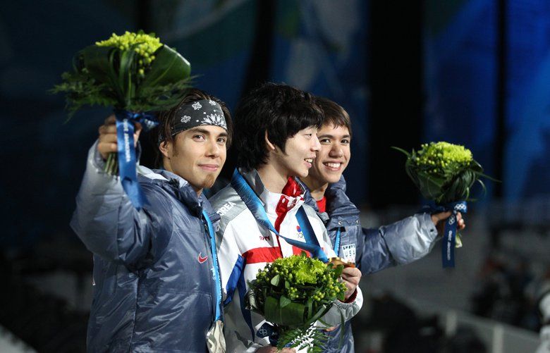 2010 WINTER OLYMPIC GAMES – MEDALS CEREMONY – BC PLACE – 101400 – 021410
Korean gold medalist Jung-Su Lee, center, is flanked by USA’s Apolo Ohno, left, silver medalist, and J.R. Celski, who took the bronze in the men’s 1,500m short-track speedskating event.