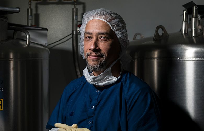 Luis Lora, a master tissue technician at MTF Biologics, in front of live tissue storage tanks in Edison, New Jersey. (Christopher Occhicone / The New York Times)