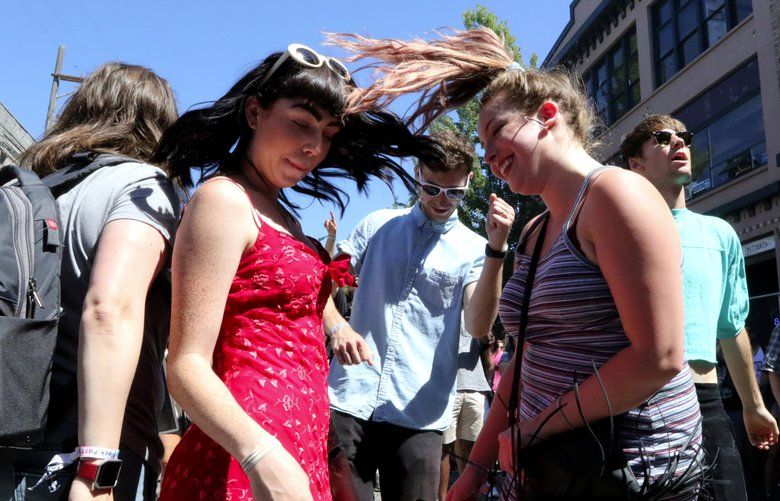 Ginny O’Leary, in red, and Lindsey Wonder dance to the music of Cosmos on the Main Stage at the Capitol Hill Block Party on Saturday, July 22, 2017.
ref to more photos online