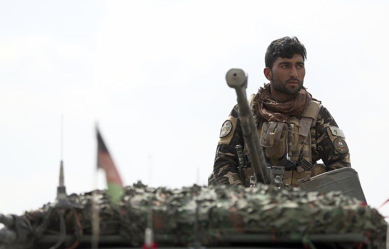 A soldier stands guard near the site of a suicide attack in Kabul, Friday, March 9, 2018. A suicide bomber targeting Afghanistan’s minority Hazaras blew himself up at a police checkpoint in western Kabul on Friday, killing nine people and wounding more than a dozen, officials said. (AP Photo/Massoud Hossaini) MAH114 MAH114