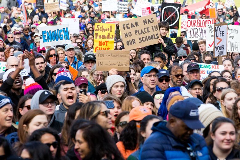 Thousands gather to listen to speeches at Seattle Center after marching from Cal Anderson Park during the March For Our Lives protest on Saturday. (Courtney Pedroza / The Seattle Times)