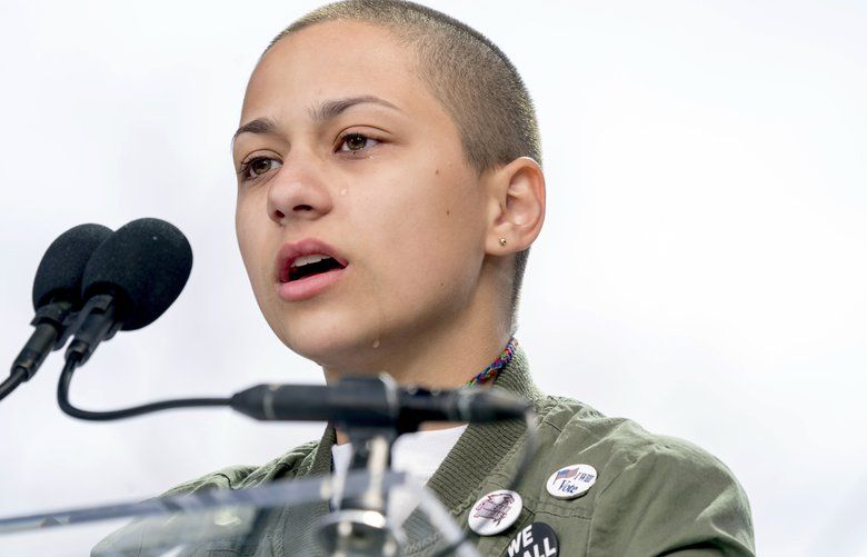 FILE — In this March 24, 2018 file photo, Emma Gonzalez, a survivor of the mass shooting at Marjory Stoneman Douglas High School in Parkland, Fla., closes her eyes and cries as she stands silently at the podium for the amount of time it took the Parkland shooter to go on his killing spree during the “March for Our Lives” rally in support of gun control in Washington. A doctored photo online appeared to show Gonzalez tearing up the U.S. Constitution. , Saturday, March 24, 2018.  (AP Photo/Andrew Harnik File) NJSM101 NJSM101