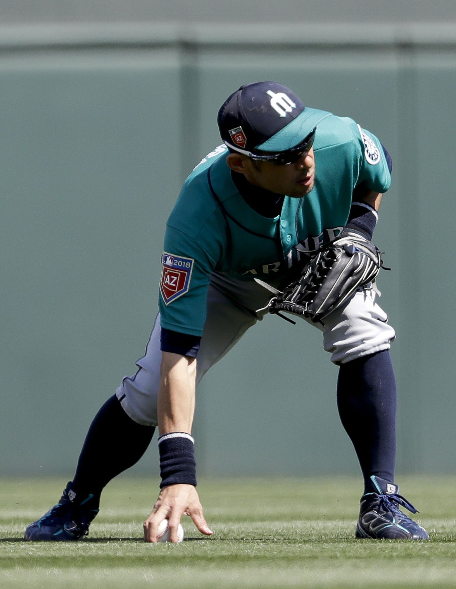 Seattle Mariners' Ichiro Suzuki holds his bat as he stands in the