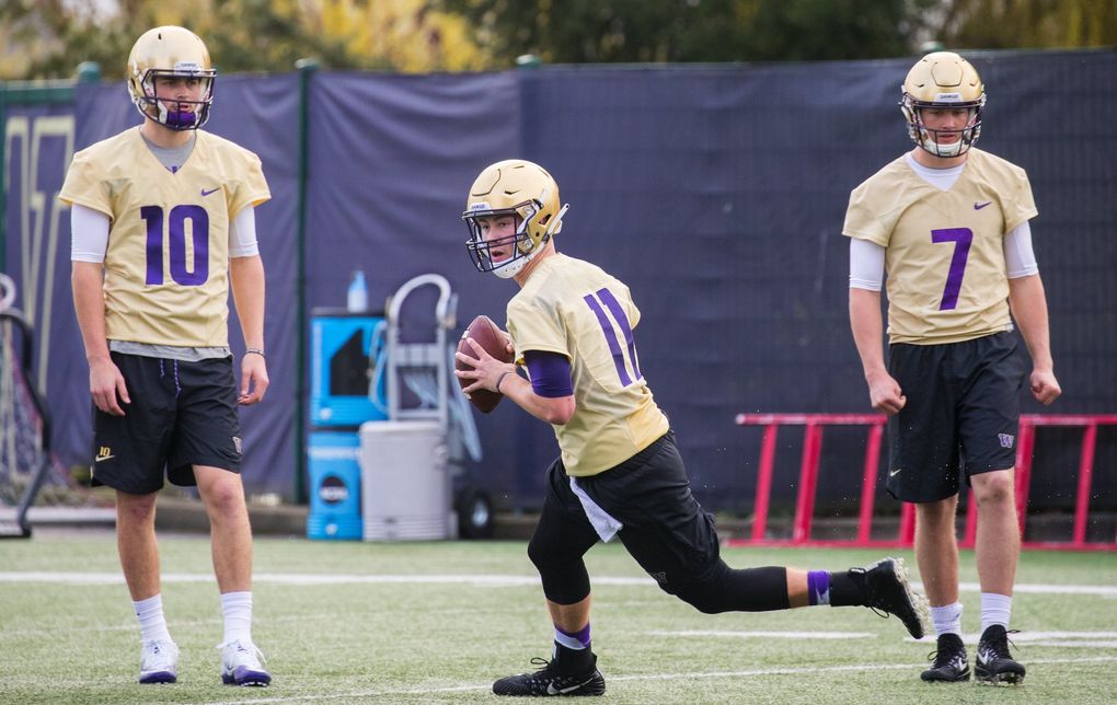 UW quarterback Jacob Sirmon, center, on the first day of spring practice for the UW Husky football team on Wednesday.
Wednesday was the first day of spring practice for the UW football team. At left is Jacob Eason and at right is Colson Yankoff. (Mike Siegel / The Seattle Times)