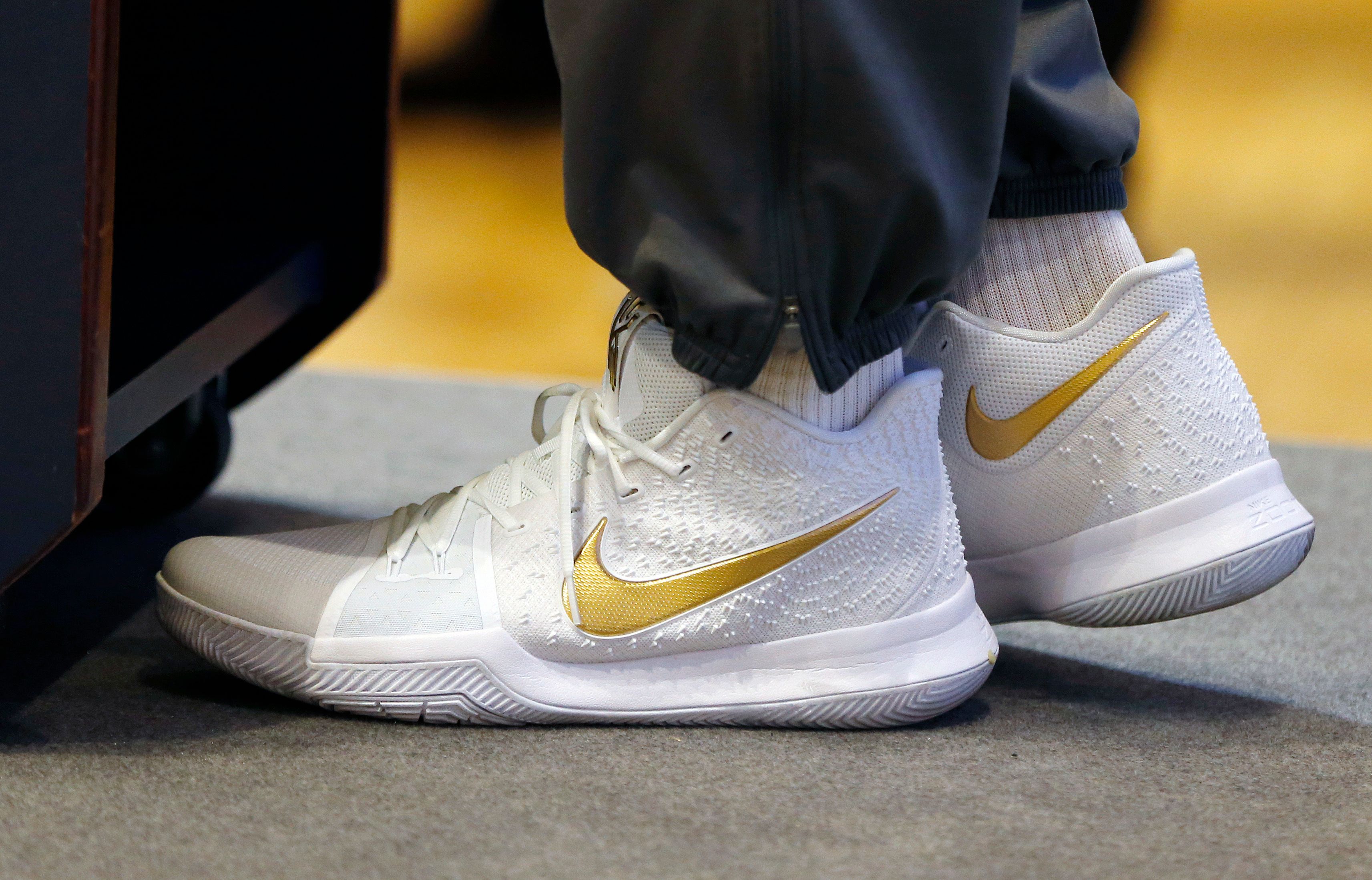 Kyrie 3 finals gold hotsell on feet