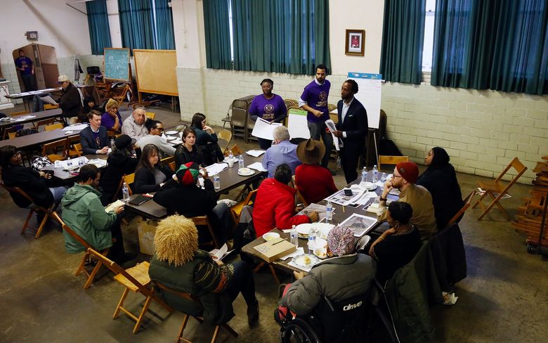 The Community and Economic Development Action Team meets about the Hazelwood neighborhood plan at the Spartan Community Center in February. Amazon’s potential impact is a source of debate in the area. (Ryan Loew/PublicSource)