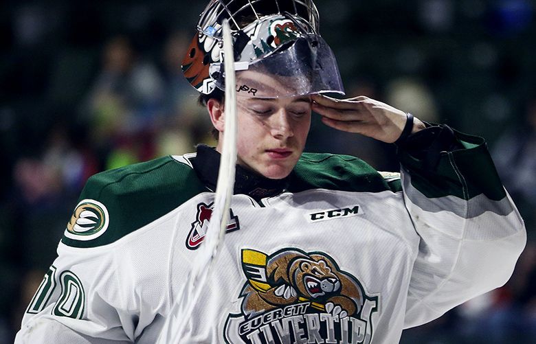 Everett Silvertips goalie Carter Hart wipes at his face during the first period in game 3 of a best-of-seven series during the second round of the WHL playoffs at Xfinity Arena in Everett on Wednesday, April 13, 2016. The Seattle Thunderbirds won 5-0.