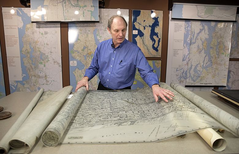 John Loacker, third-generation owner of the Kroll Map Company, shows a hand-drawn map of Seattle on mylar, used and updated from the late 1960s to the late 1980s. Even though they generate maps on the computer now, Loacker and Chief Cartographer Maria Brown try to preserve elements of the original style. “I appreciate maps and cartography, but I love the process we have, of taking these maps that have the same look through generations and making them incorporate data,” said Loacker. 


Thursday January 4, 2018.