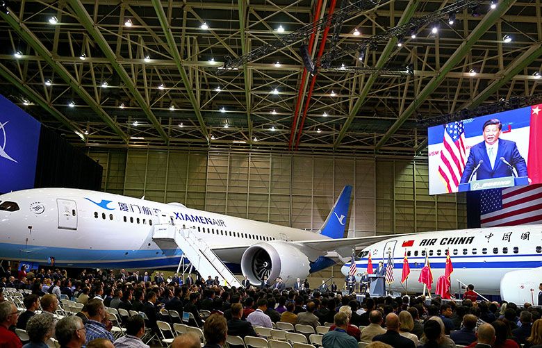 The scene inside the hangar where Chinese President Xi Jinping addressed the crowd after taking a factory tour at Boeing on Wednesday, September 23, 2015, in Everett, Wash. At left is a Boeing 787-8, and at right a Boeing 737-800, both destined for airlines in China. 

STATE VISIT BY CHINESE PRESIDENT XI JINPING – BOEING EVERETT PLANT – 150253 – 092315
