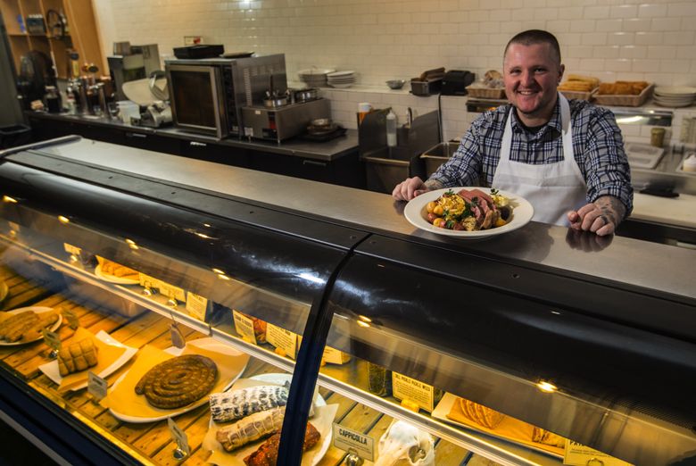 Brendan McGill serves corned beef regularly at his restaurants. But come St. Patrick’s Day, he makes a special corned beef and cabbage meal.  (Ellen M. Banner/The Seattle Times)