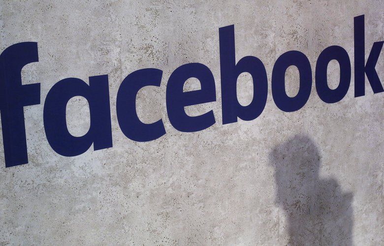 File – This Jan. 17, 2017, file photo shows a Facebook logo being displayed in a start-up companies gathering at Paris’ Station F, in Paris. A former employee of a Trump-affiliated data-mining firm says it used algorithms that “took fake news to the next level” using data inappropriately obtained from Facebook. (AP Photo/Thibault Camus, File) 