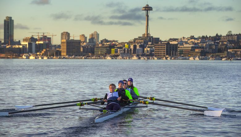 The University of Washington women’s rowing team including rowers from left, Marlee Blue, Tabea Schendekehl, Brooke Mooney, and Elise Beuke row in Lake Union during an recent early morning practice. (Mike Siegel / The Seattle Times)