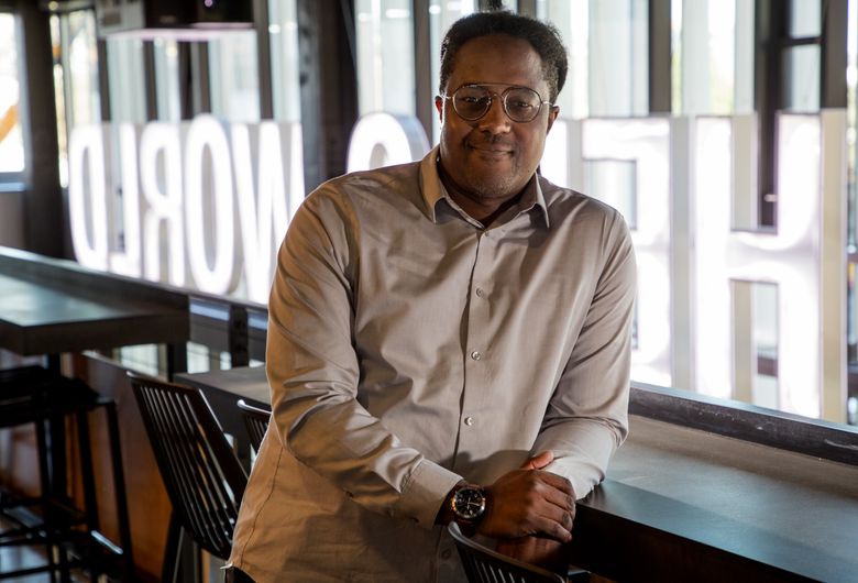 Cedric Ross, a former bassist for Seattle funk-rock bank Imij, started at Amazon in 1997 in the shipping department of the company’s single warehouse in Sodo. Today, he runs a tour program at Amazon warehouses in North America. (Mike Siegel/The Seattle Times)